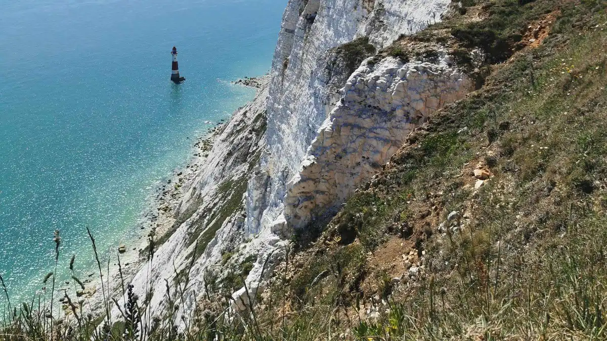 Seven Sisters white chalk cliffs above the sea on a South Downs day tour from London, England