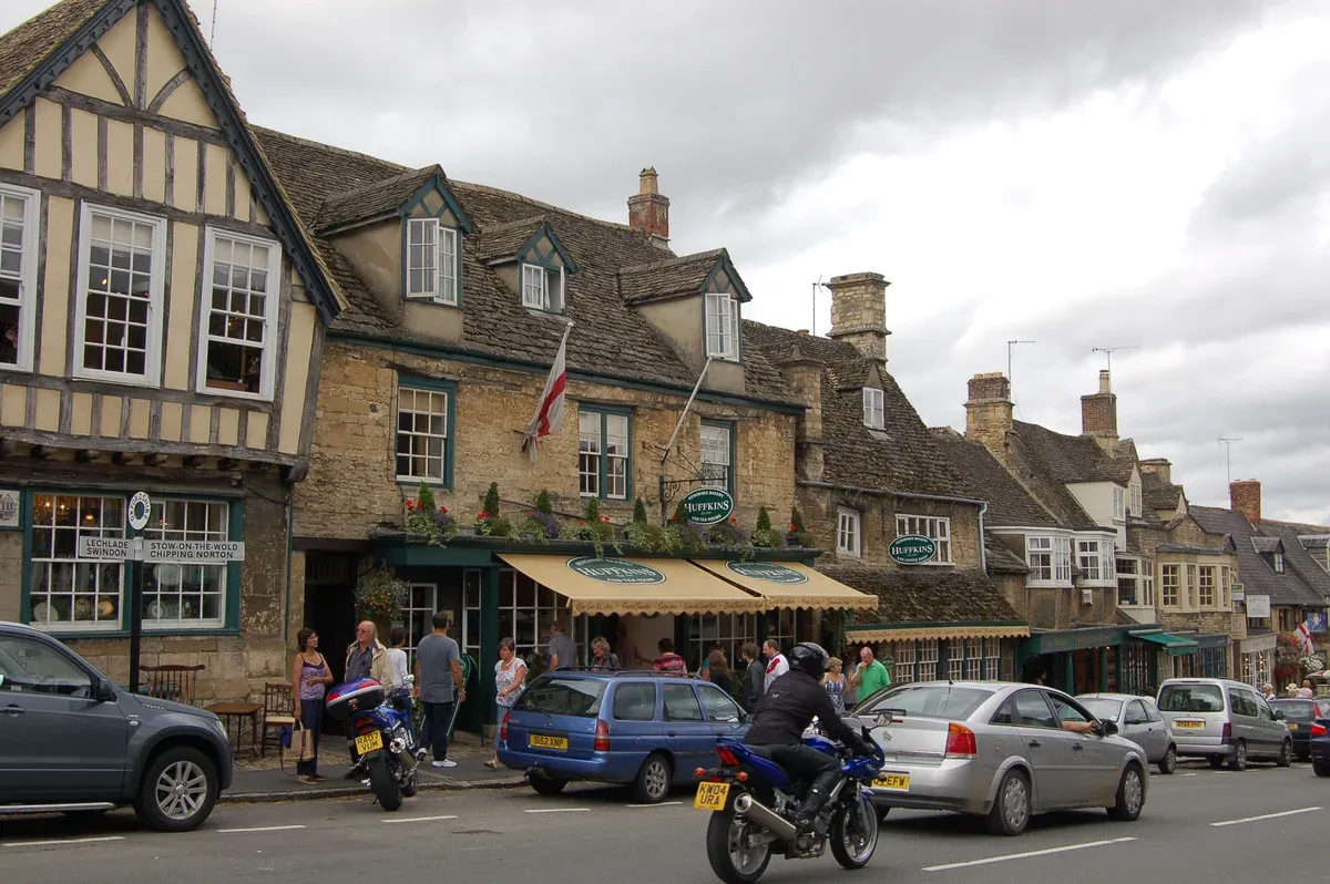 Timber-framed and stone buildings on Burford High Street on an Oxford and Cotswolds day trip from London