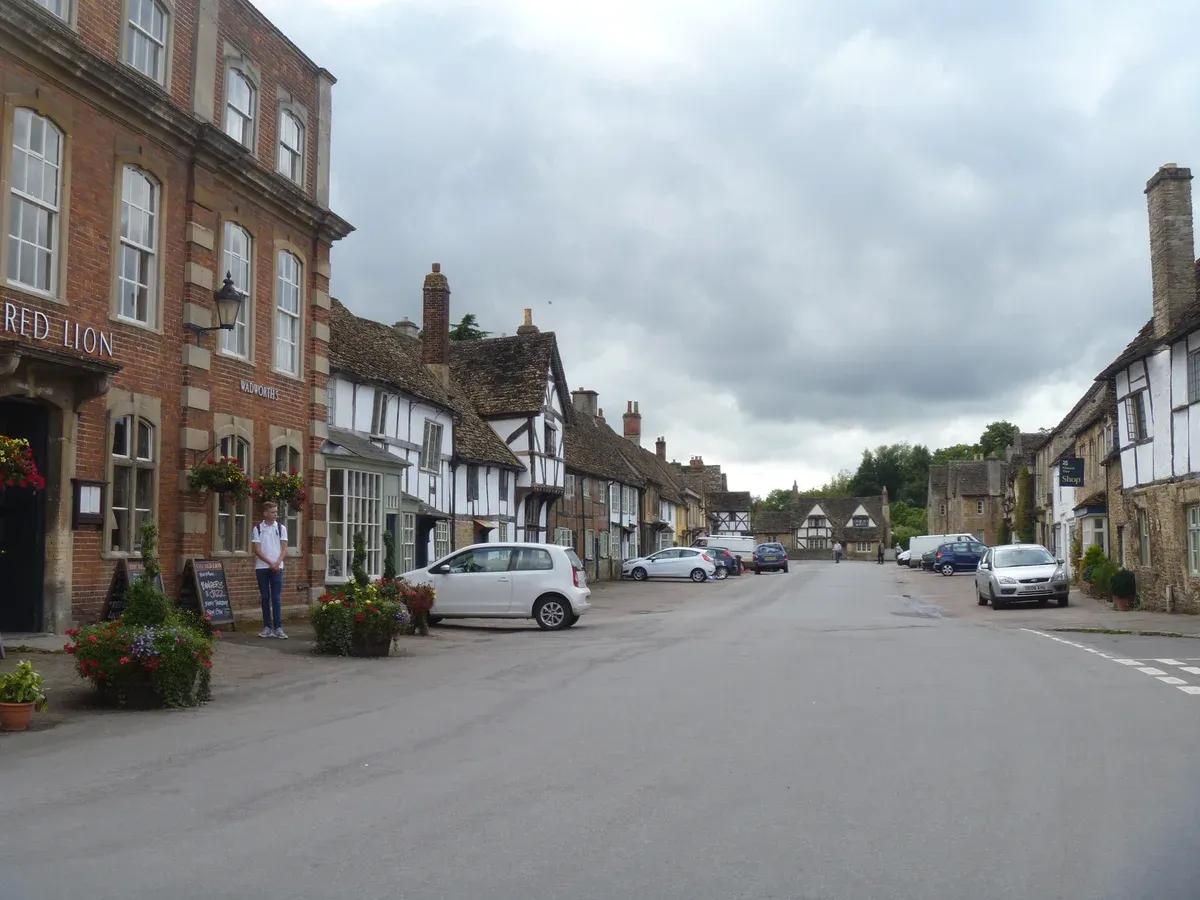 Timber-framed and stone houses on High Street in Lacock on a Bath, Avebury and Lacock day trip from London