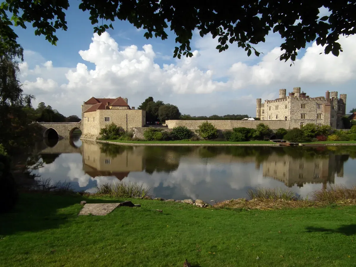 Leeds Castle reflected in its lake in Kent on a Canterbury, Dover and Leeds Castle day trip from London